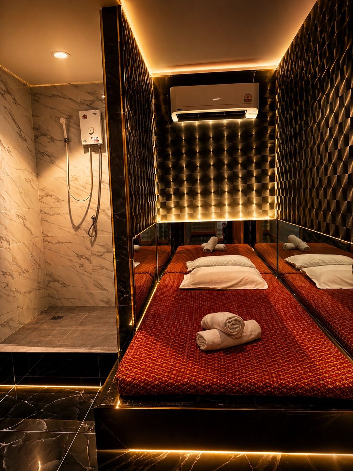 Standard shower room at Boss Massage with a walk-in shower and floor mattress
