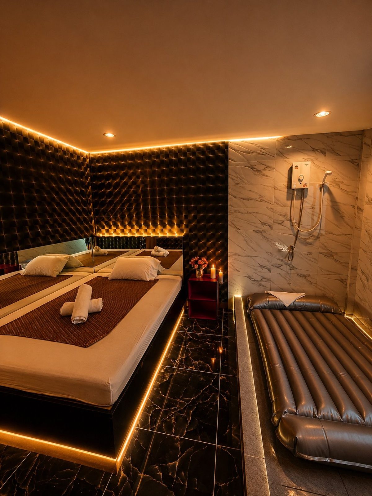 VIP nuru room with a shower, massage bed and air mattress